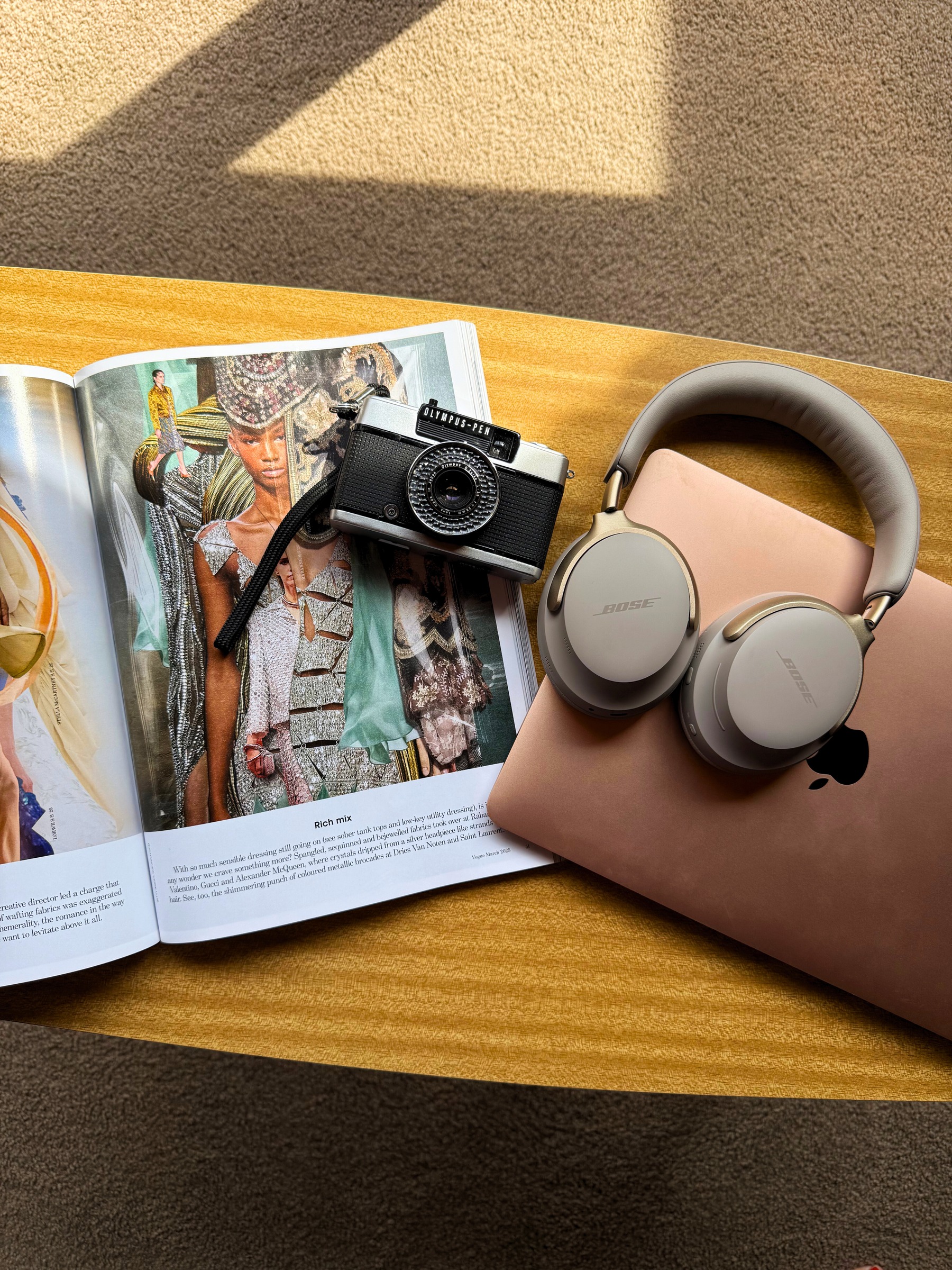 Creative flatlay with camera, headphones and laptop