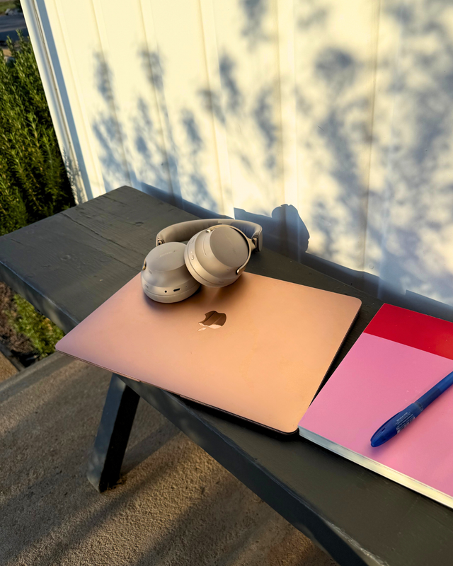 Content planning still with laptop, headphones and notebook